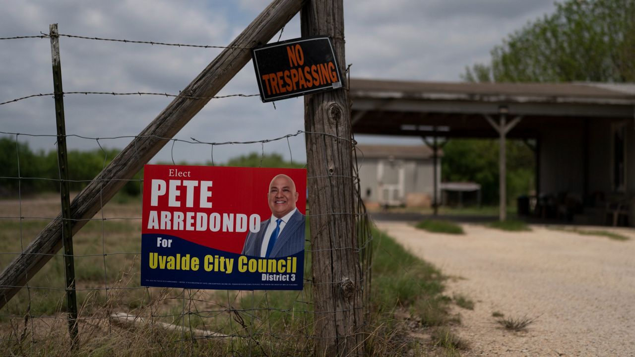 A campaign sign for Pete Arredondo, the chief of police for the Uvalde Consolidated Independent School District, is seen in Uvalde, Texas Monday, May 30, 2022. (AP Photo/Jae C. Hong)