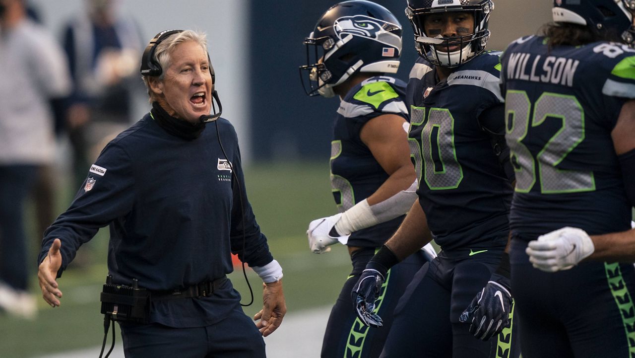 The Seahawks' Pete Carroll was one of three NFL head coaches fined $100,000 for not wearing a mask in Week 2. (AP Photo/Stephen Brashear)