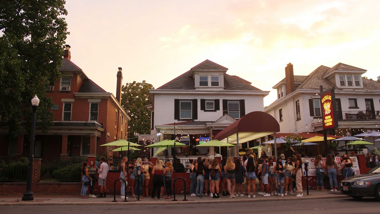 Photo of students waiting in lines at a restaurant