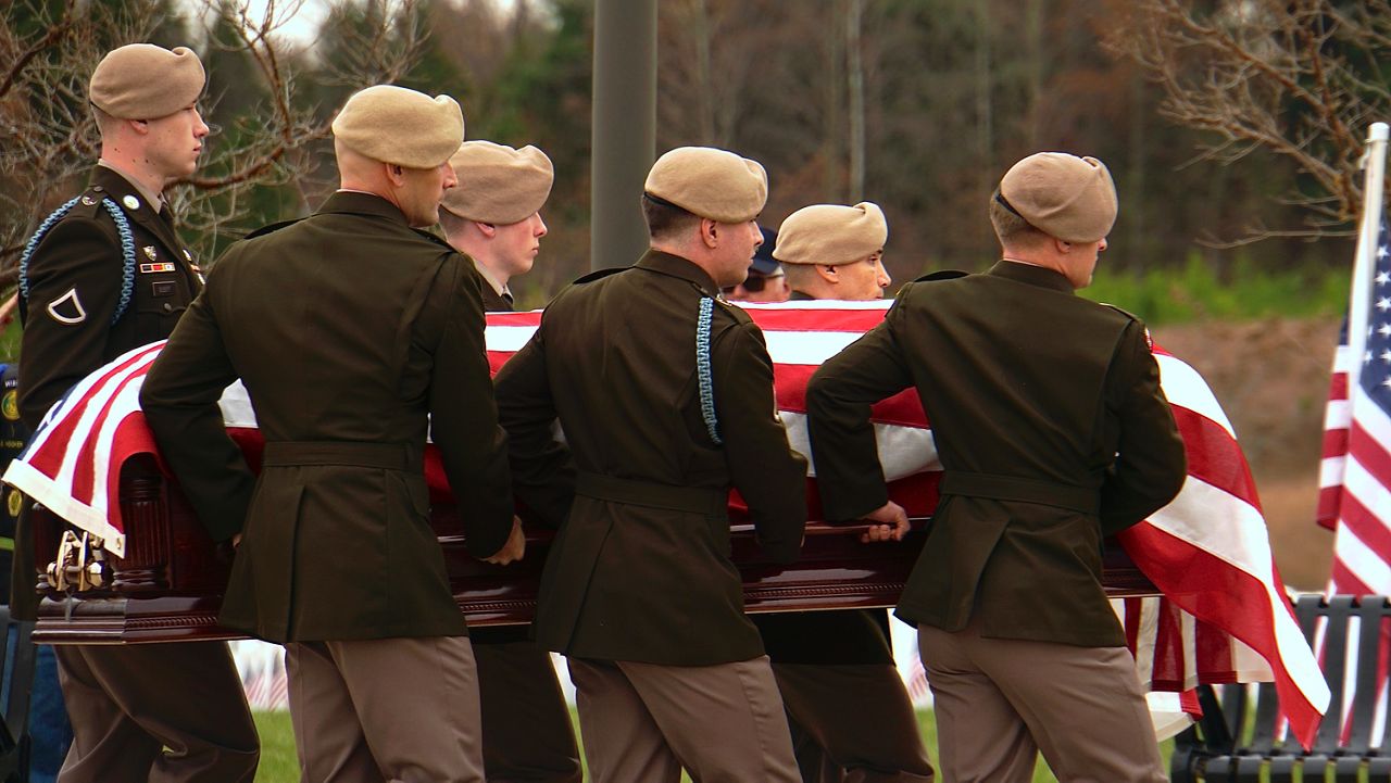 Soldiers from the 75th Ranger Regiment carry the casket of WWII veteran Pfc. Charles Wells (Spectrum News 1/Mason Brighton)
