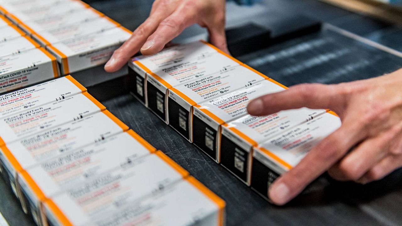 This October 2021 photo provided by Pfizer shows boxes of kid-size doses of its COVID-19 vaccine. The U.S. is preparing to roll out millions of doses next week pending a CDC decision. (Pfizer via AP)