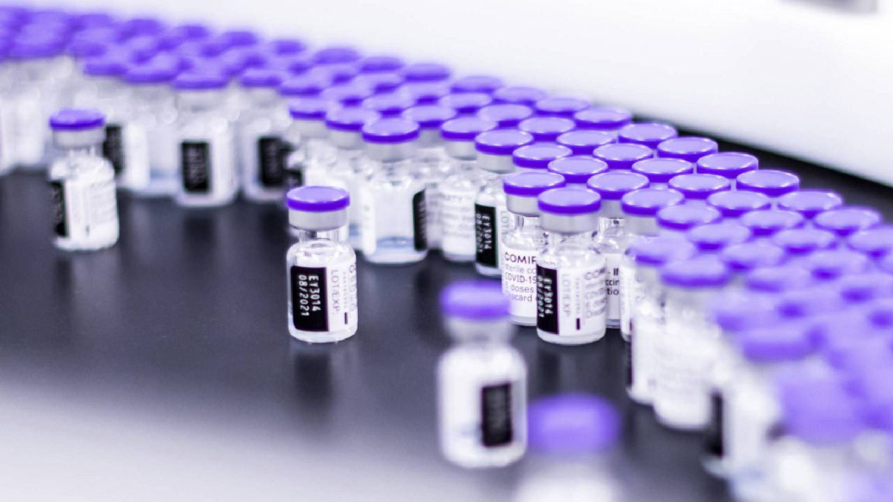 In this March 2021 photo provided by Pfizer, vials of the Pfizer-BioNTech COVID-19 vaccine are prepared for packaging at the company’s facility in Puurs, Belgium. Pfizer is about to seek U.S. authorization for a third dose of its COVID-19 vaccine, saying Thursday, July 8, 2021, that another shot within 12 months could dramatically boost immunity and maybe help ward off the latest worrisome coronavirus mutant. (Pfizer via AP)