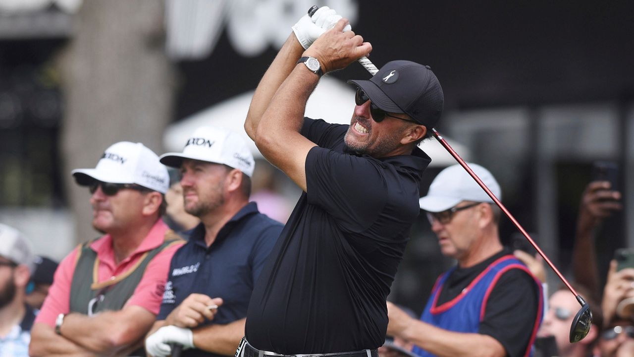 Phil Mickelson watches the flight of his tee shot on the first hole during the second round of the LIV Golf Invitational-Chicago tournament Saturday, Sept. 17, 2022, in Sugar Grove, Ill. (Joe Lewnard/Daily Herald via AP