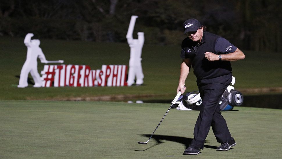 Phil Mickelson birdied the fourth playoff hole to beat Tiger Woods.