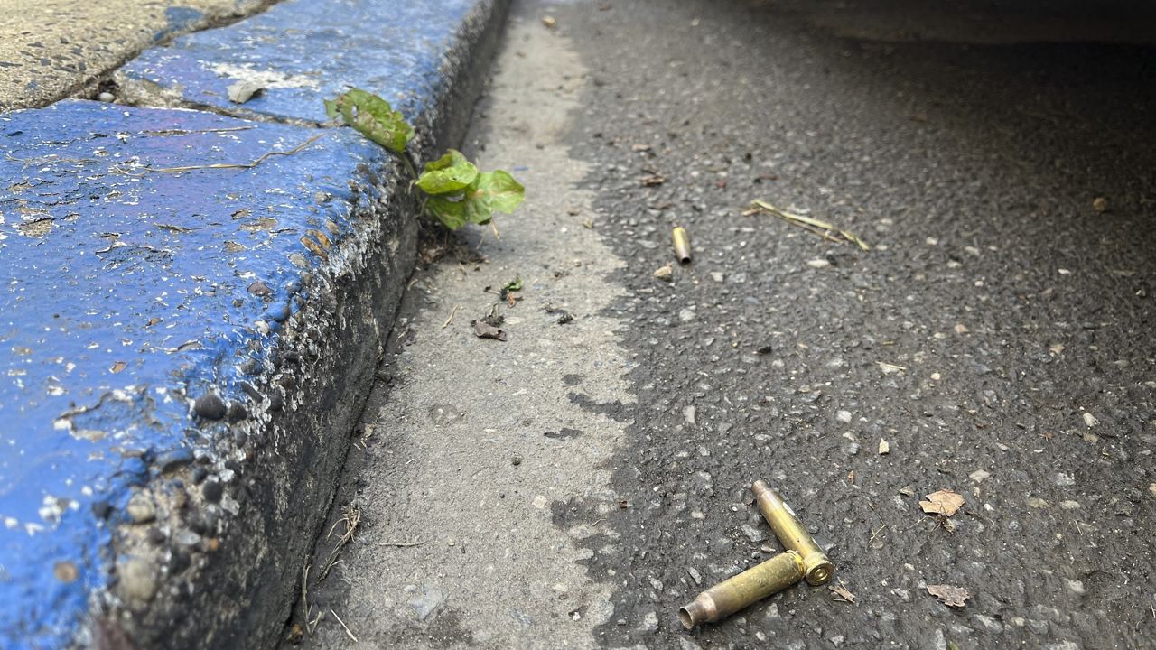 Spent shell casings are shown on the street in Philadelphia early Tuesday in Philadelphia. (AP Photo/Tassanee Vejpongsa)  
