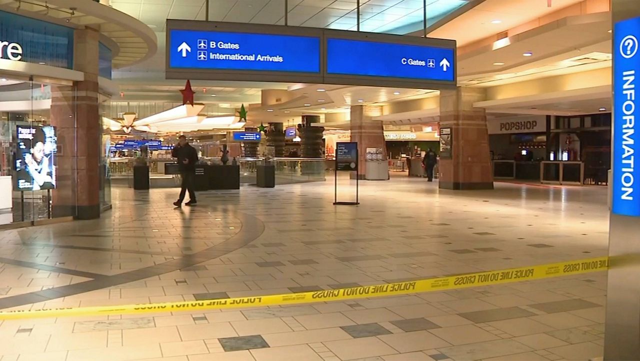 Police investigate a Christmas shooting at Sky Harbor Airport in Phoenix late Wednesday, Dec. 25, 2024. (KNXV via AP)