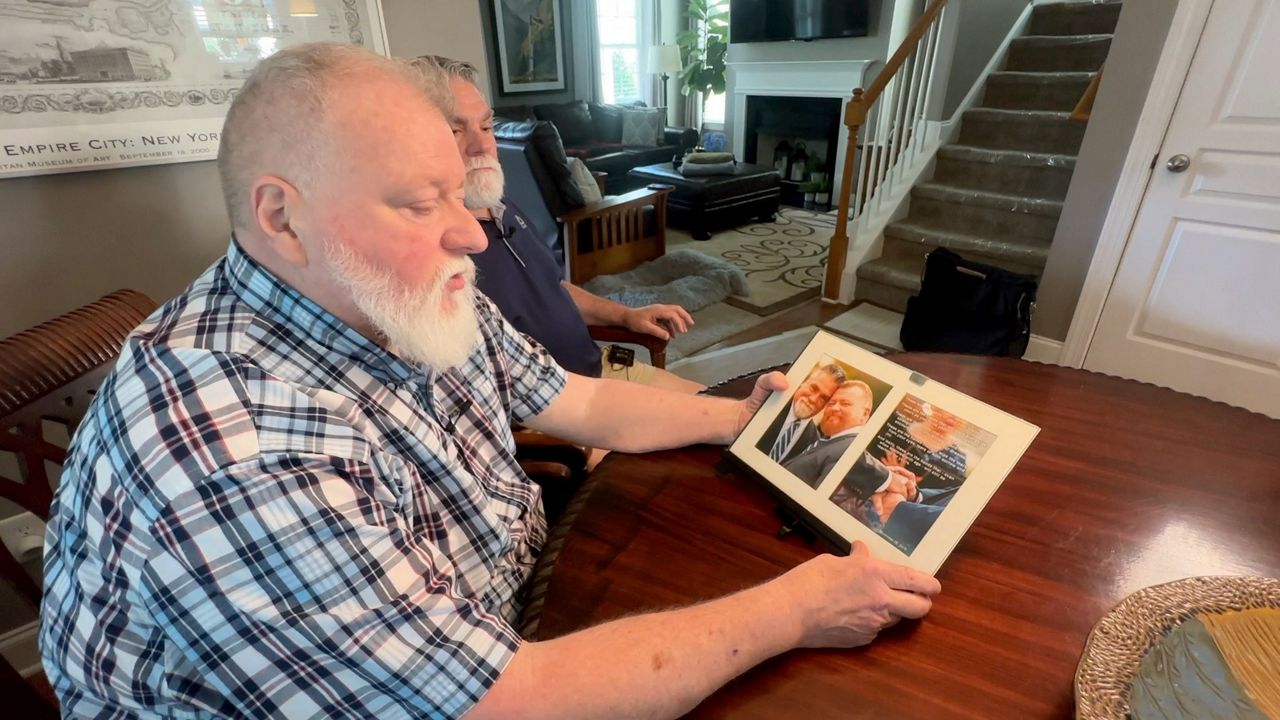 John Winn and Steve Nichols read their wedding vows. (Spectrum News 1/Nick Buffo) 