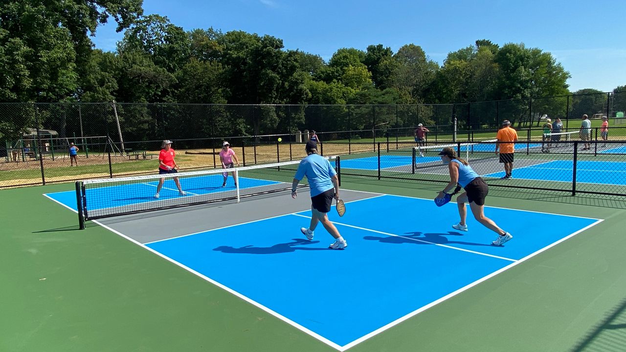 Local residents try out the Mary Beth Nienhaus Pickleball Complex that opened Tuesday in Appleton.
