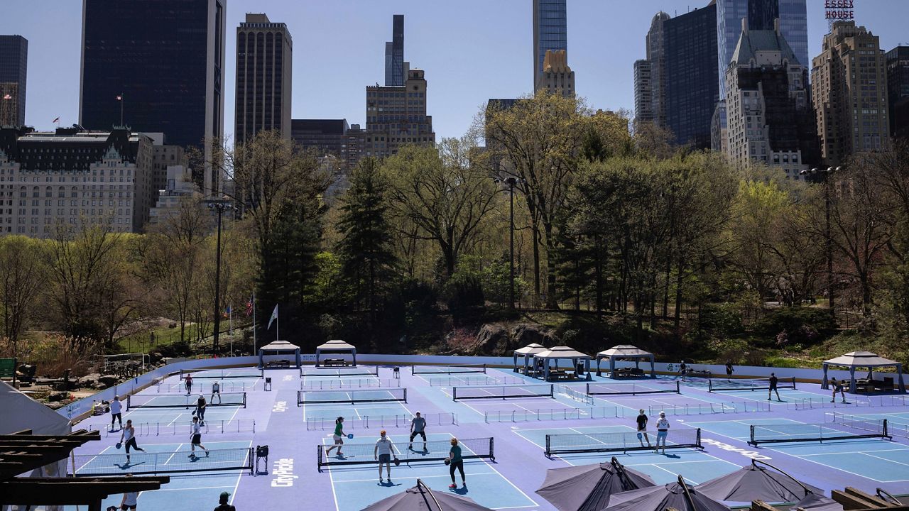 People play pickleball at Wollman Rink at Central Park in New York on Wednesday, April 12, 2023.