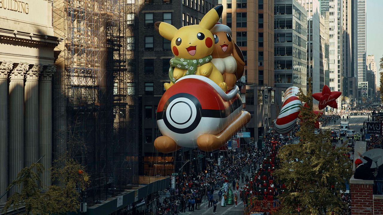 Pikachu balloon floats along 6th Avenue during the Macy's Thanksgiving Day Parade, Thursday, Nov. 24, 2022, in New York (AP Photo/Andres Kudacki)