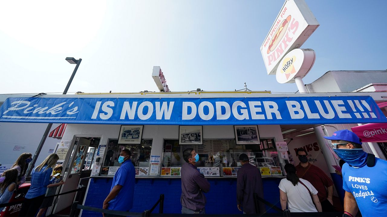Pink's Hot Dogs is decorated in Dodgers blue in support of the Los Angeles Dodgers, who are playing in the 2020 World Series against the Tampa Bay Rays Wednesday, Oct. 21, 2020, in Los Angeles. (AP Photo/Ashley Landis)
