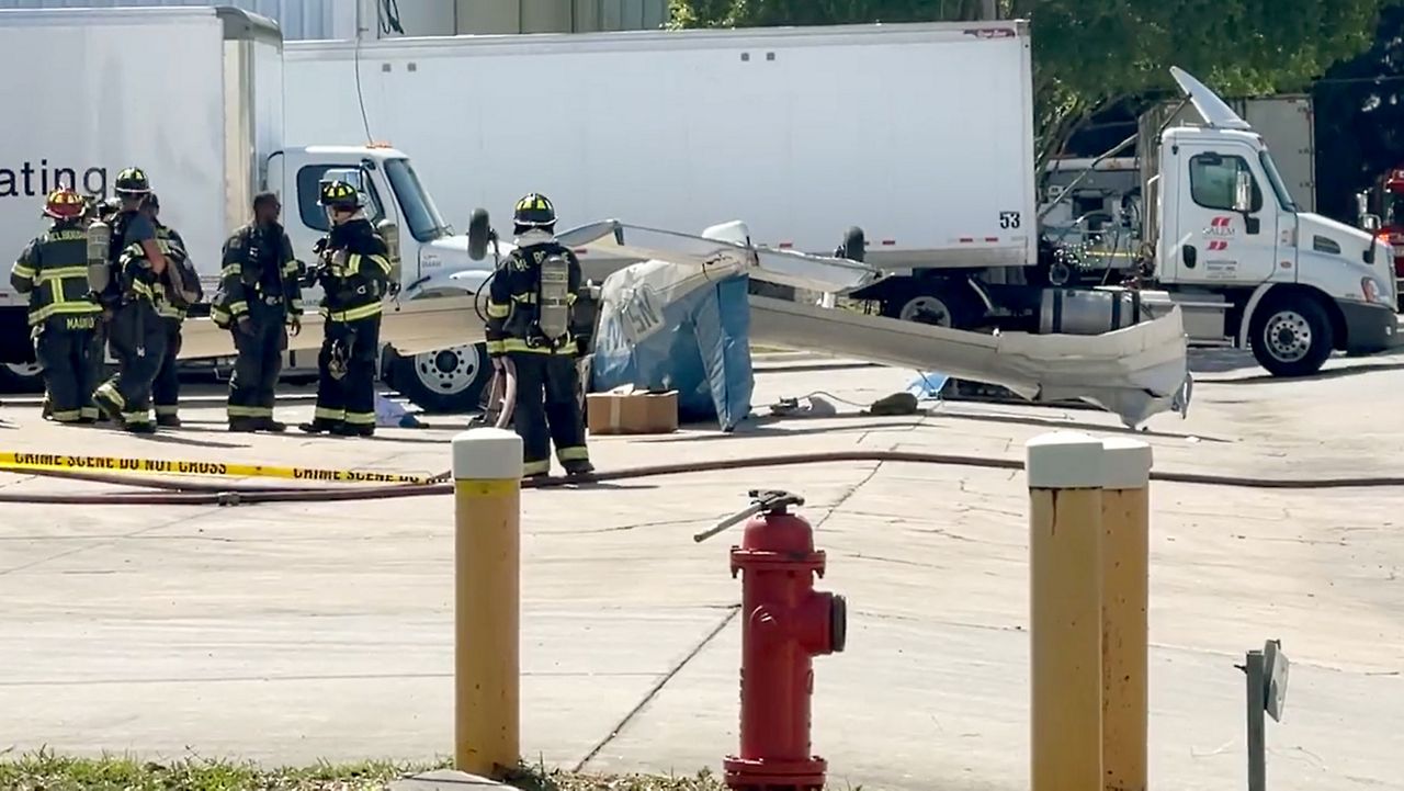 Emergency personnel respond to the scene of single-engine plane crash Tuesday near Melbourne Orlando International Airport. (Spectrum News 13/Greg Pallone)