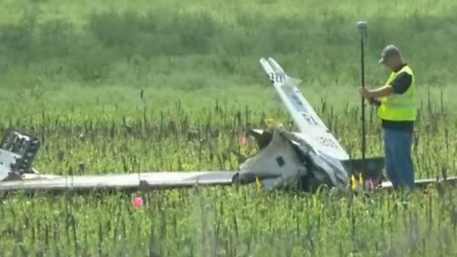 The wreckage of an Air Force plane that crashed on Sept. 18, 2018, is inspected. (Spectrum News)