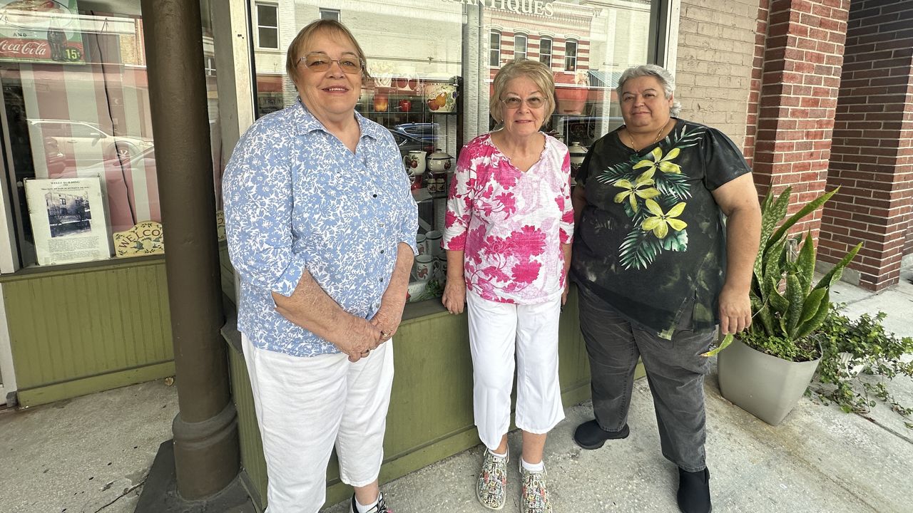 Pam Gordon (left), Carol Maietta (center) and Maddie Lattarulo (right) with Rocking Horse Antiques & Collectibles. (Spectrum News/Lizbeth Gutierrez)