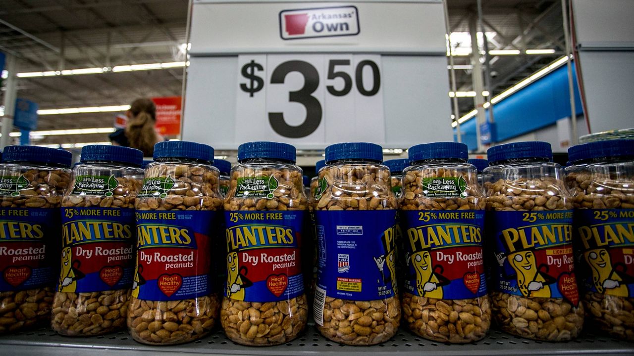 This June 7, 2013, photo shows a display of Planters dry roasted peanuts, which are not included in the recall, at a Walmart store in Rogers, Ark. (AP Photo/Gareth Patterson, File)