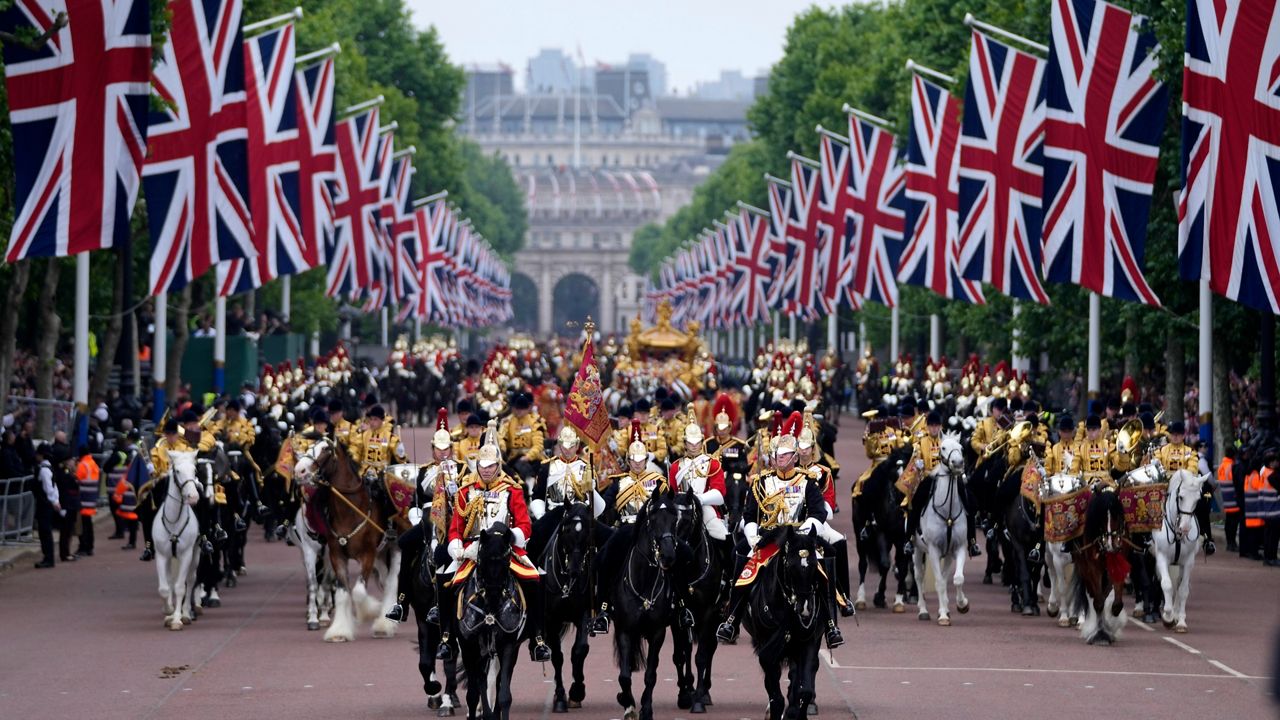 Soldiers parade during the Platinum Jubilee Pageant outside Buckingham Palace in London, Sunday, June 5, 2022, on the last of four days of celebrations to mark the Platinum Jubilee. The pageant will be a carnival procession up The Mall featuring giant puppets and celebrities that will depict key moments from the Queen Elizabeth II's seven decades on the throne. (AP Photo/Frank Augstein, Pool)