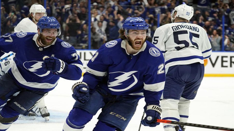 Tampa Bay Lightning center Brayden Point (21) celebrates after scoring the game-winning goal during sudden-death overtime in Game 6 of an NHL hockey first-round playoff series Thursday, May 12, 2022, in Tampa, Fla. (AP Photo/Chris O'Meara)