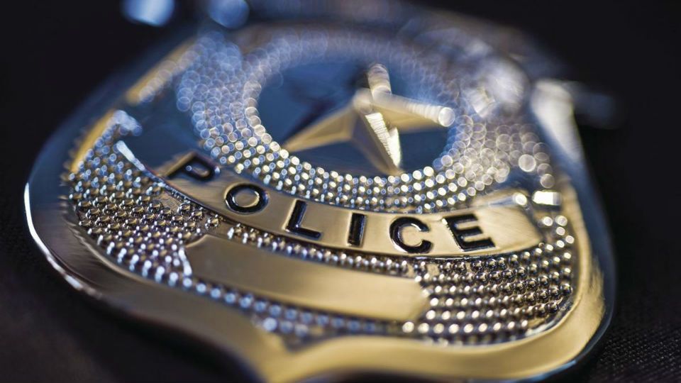 Image of a generic police badge (Spectrum News)