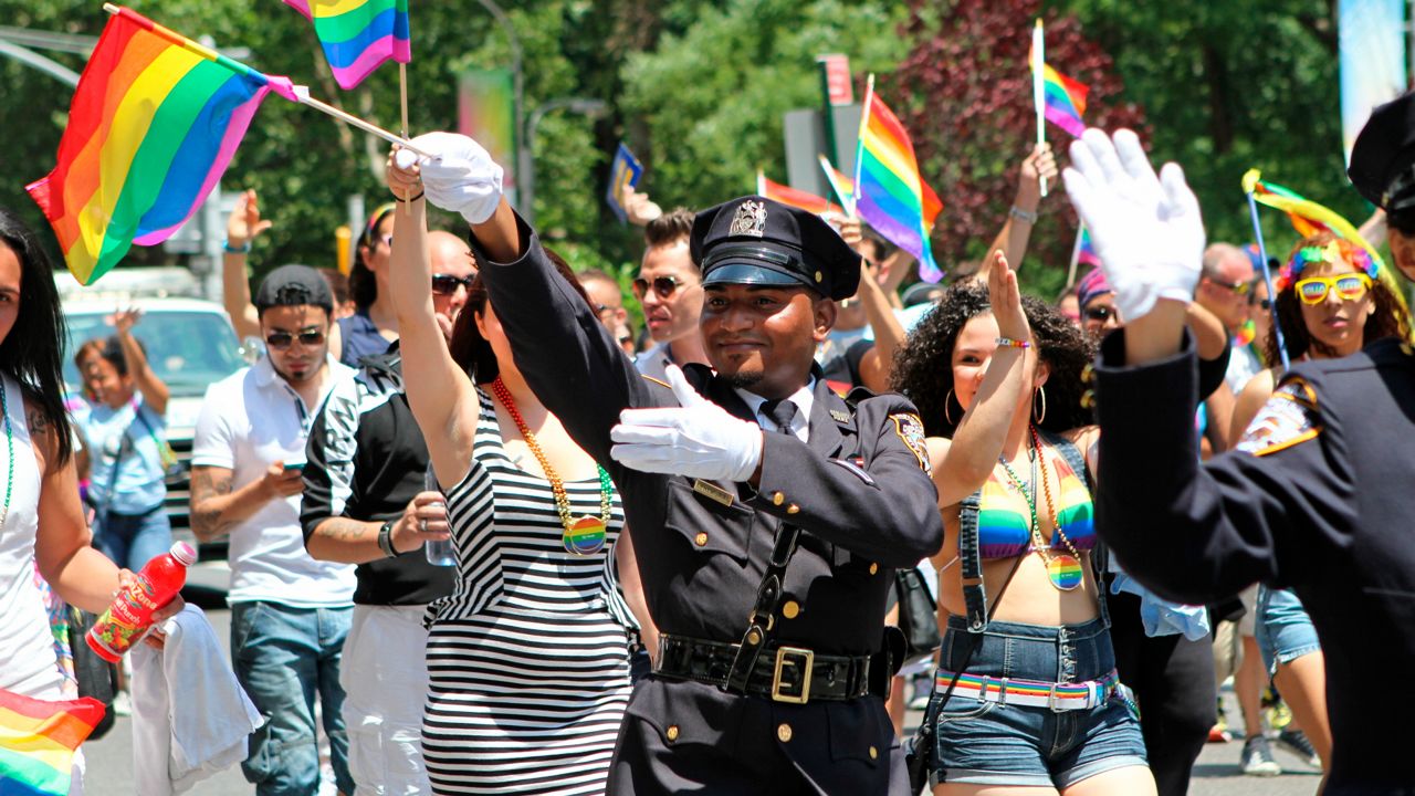 Police officers marching in the Pride march up Fifth Avenue in 2014. (AP Photo/Julia Weeks, File)