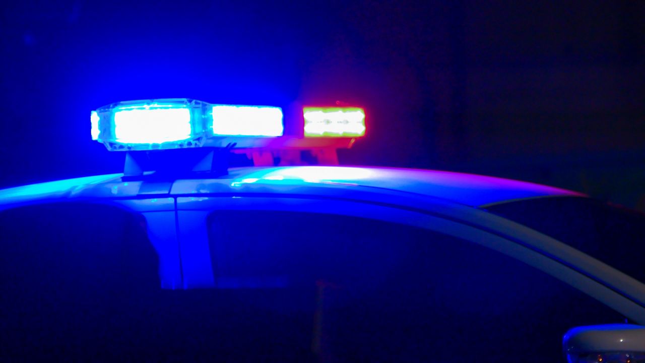 An image of a police car and its siren lights. 