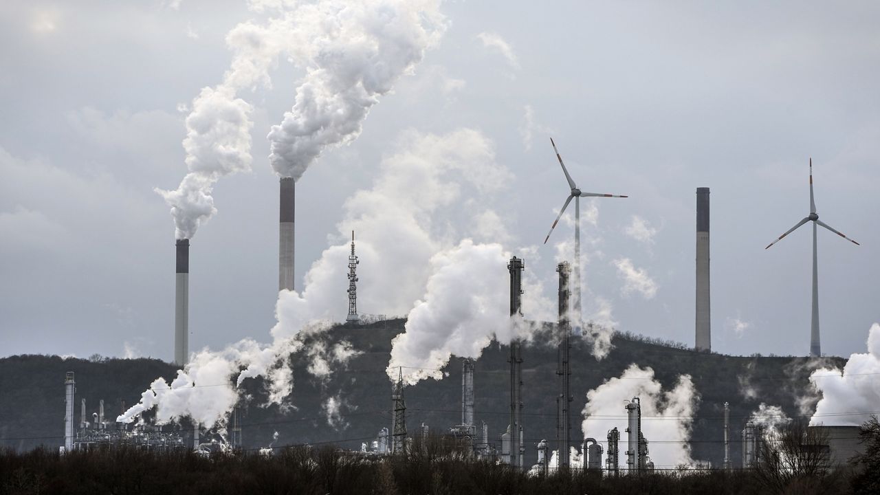 The industrial backdrop of a BP refinery and a Uniper coal-fired power plant is seen in Gelsenkirchen, Germany on March 6. (AP Photo/Martin Meissner, File)