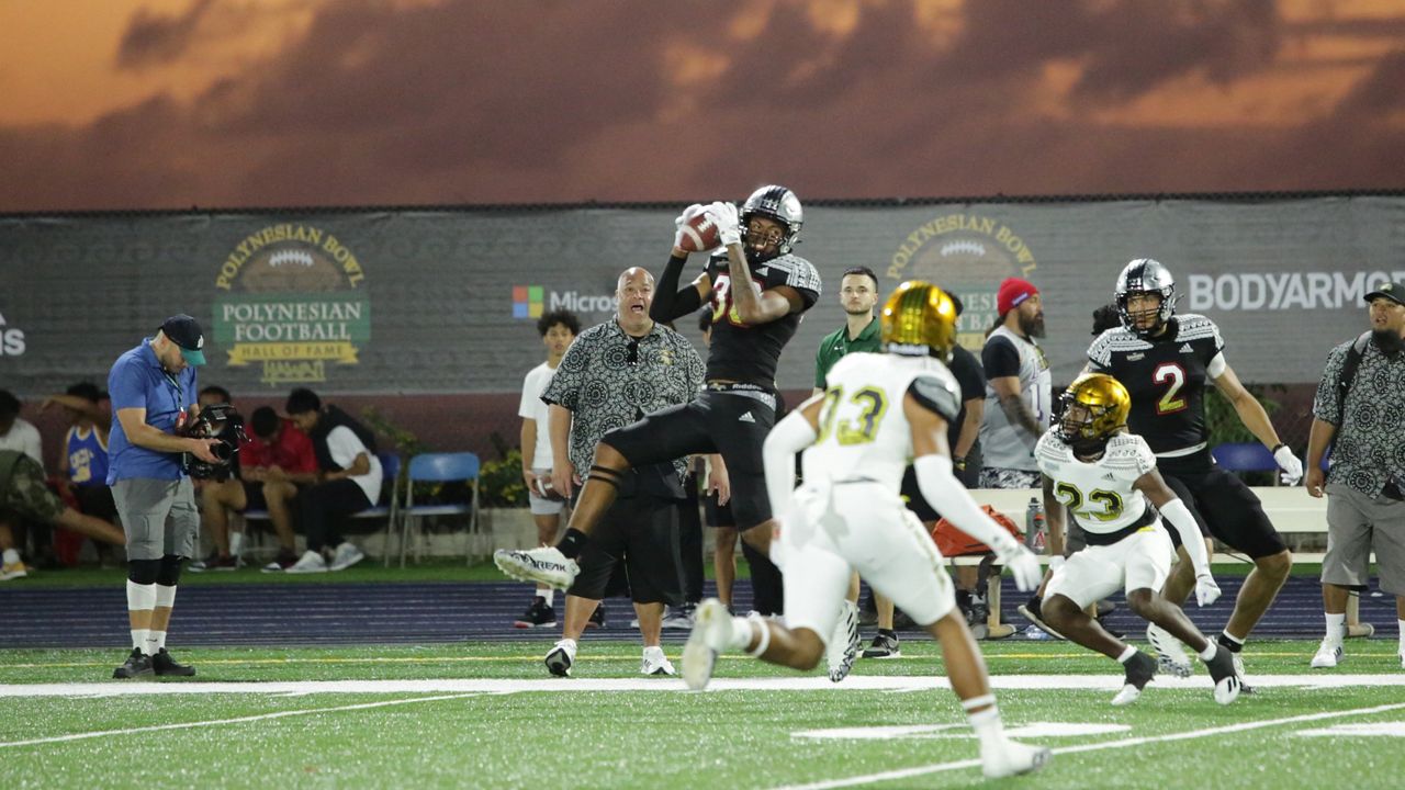 Campbell High's Mason Muaau caught a 21-yard pass as a tight end for the Mauka team at sunset at Kamehameha's Kunuiakea Stadium.