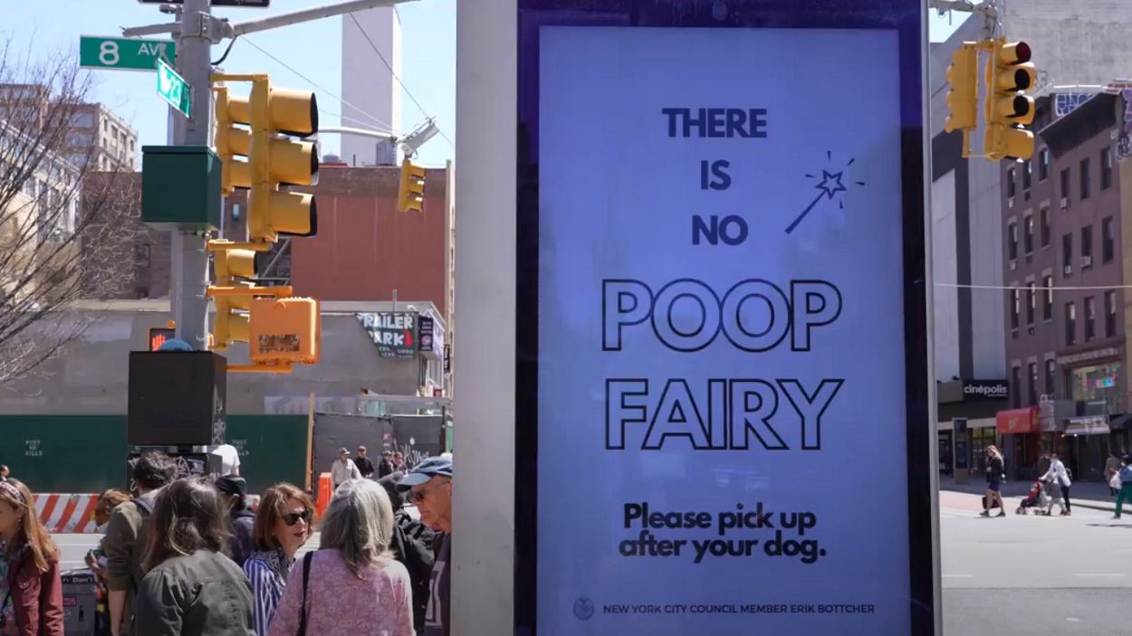 A sign in New York City saying "There is no poop fairy" which is encouraging people to pick up after their dogs.