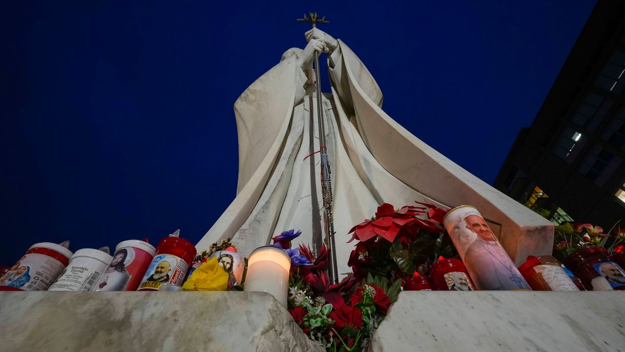 A statue of Pope John Paul II is seen on Wednesday, Feb. 19, 2025, in front of the Agostino Gemelli Polyclinic in Rome, where Pope Francis has been hospitalized since Friday, Feb. 14. (AP Photo/Andrew Medichini)