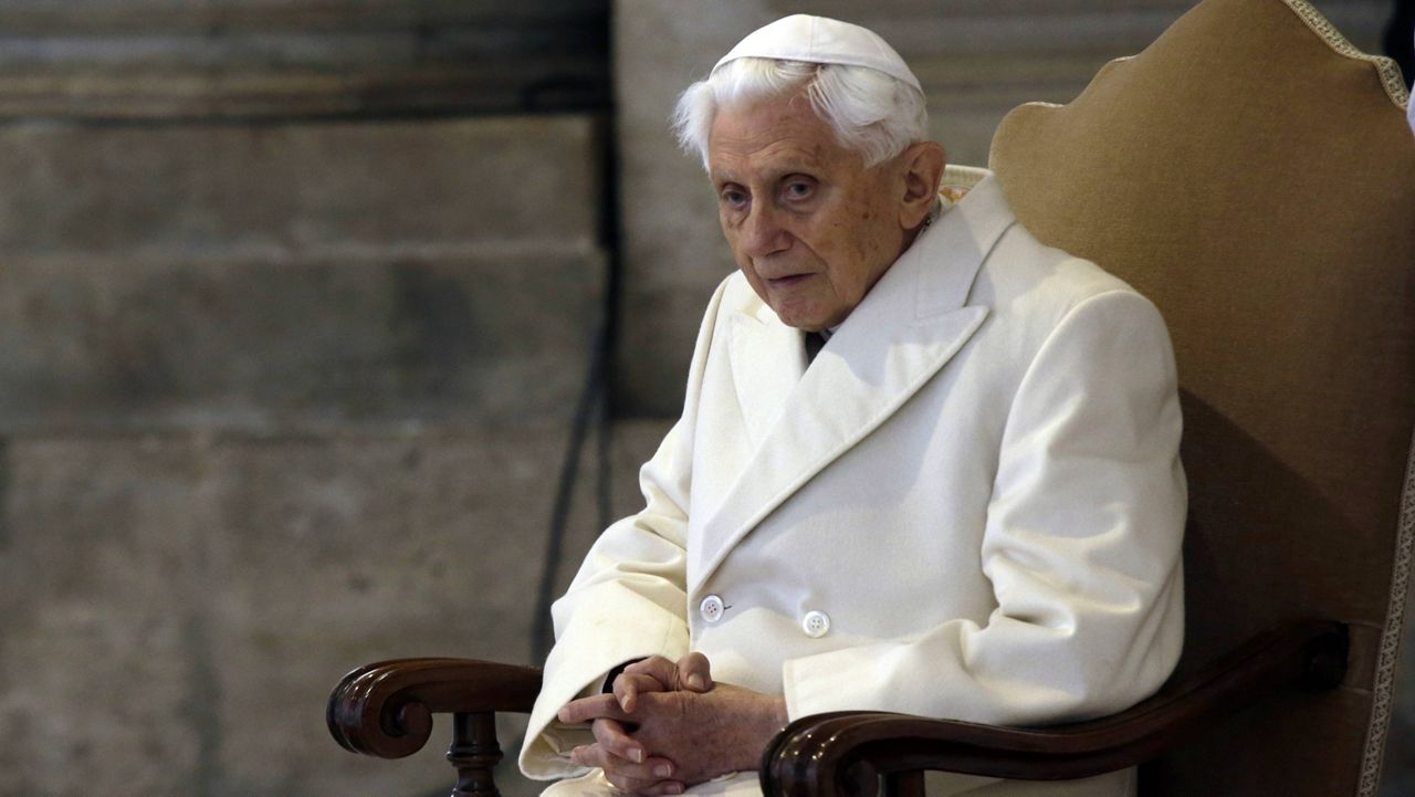 This Dec. 8, 2015, file photo shows Pope Emeritus Benedict XVI sitting in St. Peter's Basilica. (AP Photo/Gregorio Borgia)