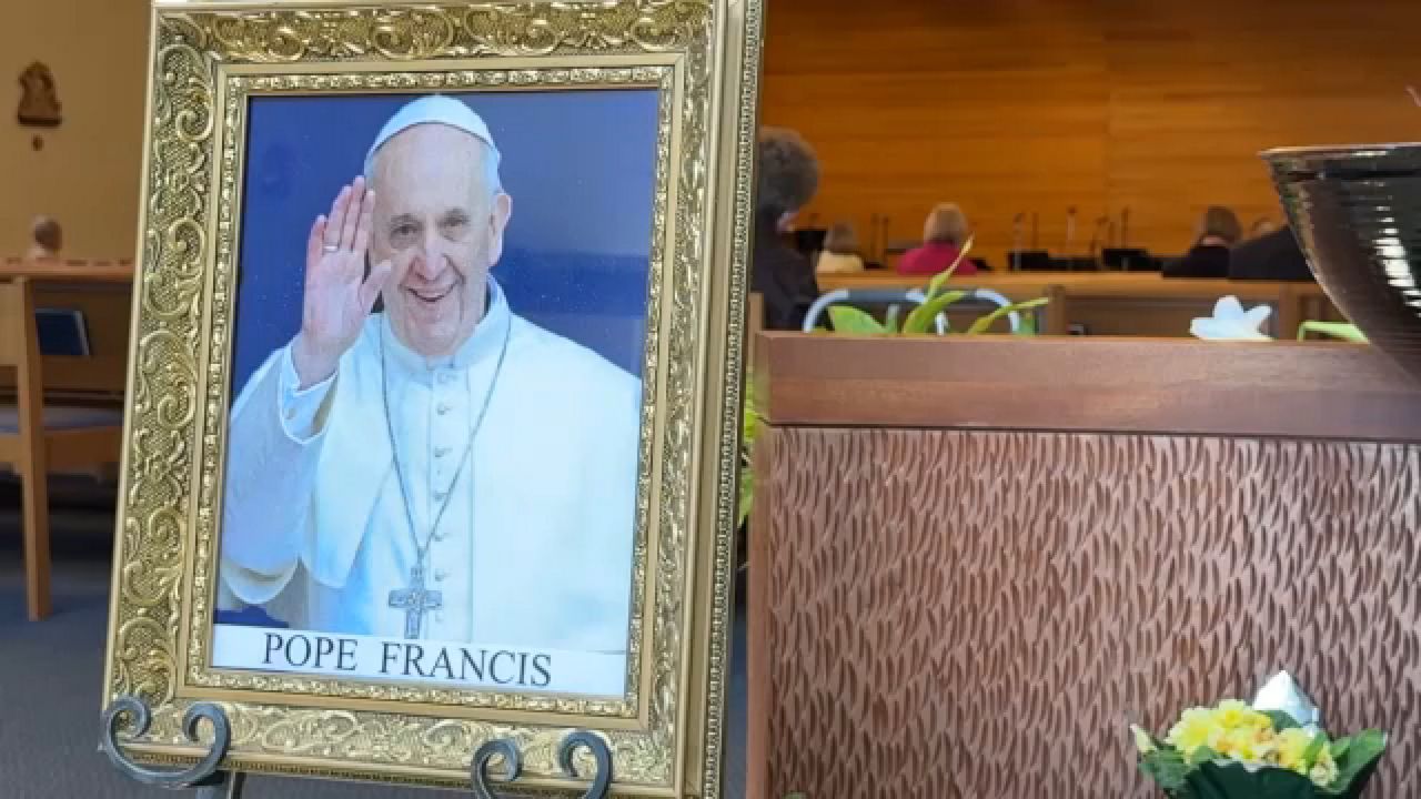 Photo of Pope Francis displayed in a church