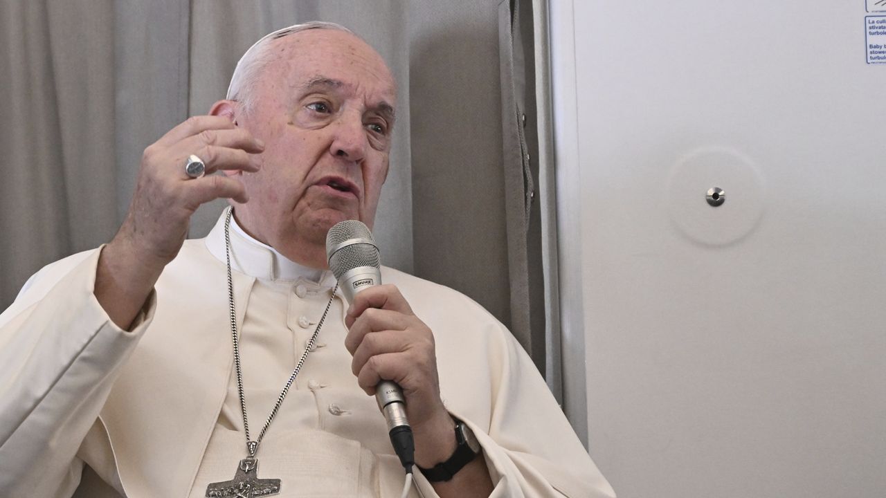 Pope Francis meets the journalists during an airborne press conference aboard the airplane directed to Rome, at the end of his pastoral visit to Congo and South Sudan, Sunday, Feb. 5, 2023. (Tiziana Fabi/Pool Photo Via AP)