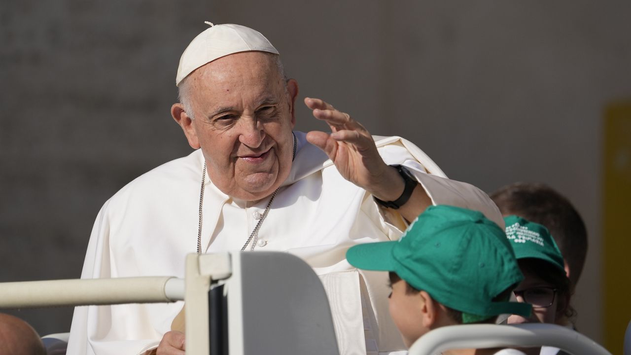 Pope Francis arrives Wednesday for his weekly general audience in St. Peter's Square at The Vatican, Wednesday. (AP Photo/Andrew Medichini)
