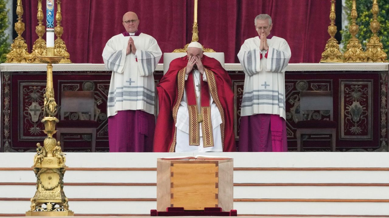 Pope Francis presides over the funeral Mass next to the coffin of the late Pope Emeritus Benedict XVI Thursday at St. Peter's Square at the Vatican. (AP Photo/Alessandra Tarantino)