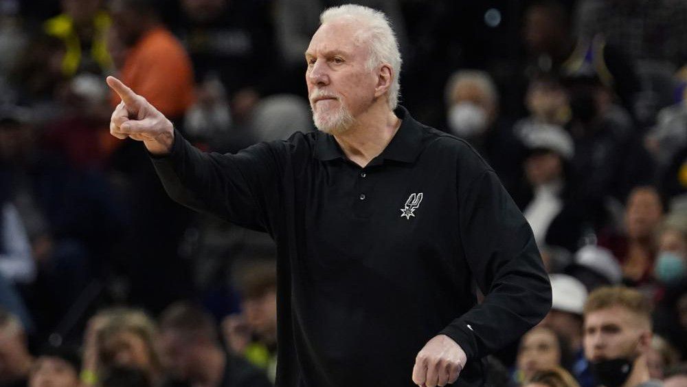 San Antonio Spurs head coach Gregg Popovich signals to his players during the first half of an NBA basketball game against the Los Angeles Lakers, Monday, March 7, 2022, in San Antonio. (AP Photo/Eric Gay)