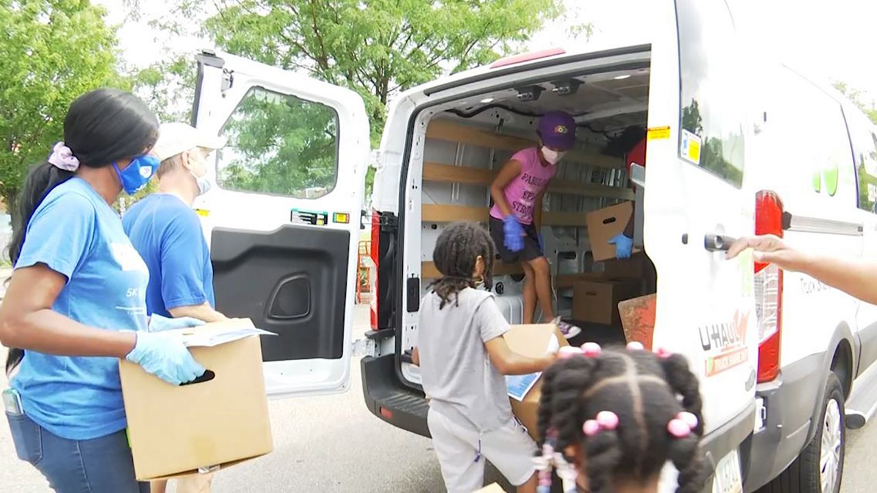 Photo of community members at the food pantry