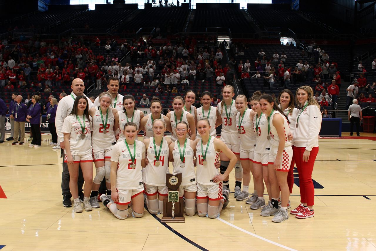 The Creston Norwayne High School girls basketball team stands with the state runners-up trophy after the OHSAA Girls State Championship at UD Arena on Saturday.