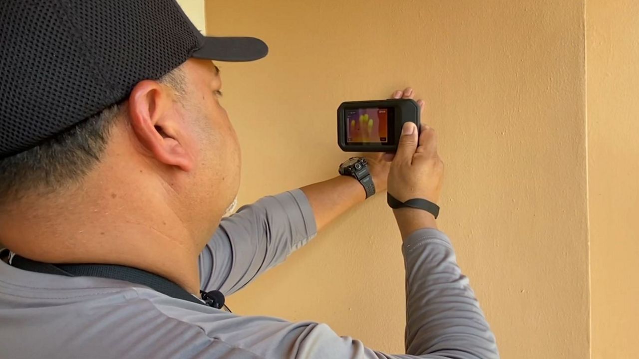 Edwin Torres, with Go Pro Home Inspections, looks for any unseen issues at a house in Belle Isle. (Spectrum News 13)