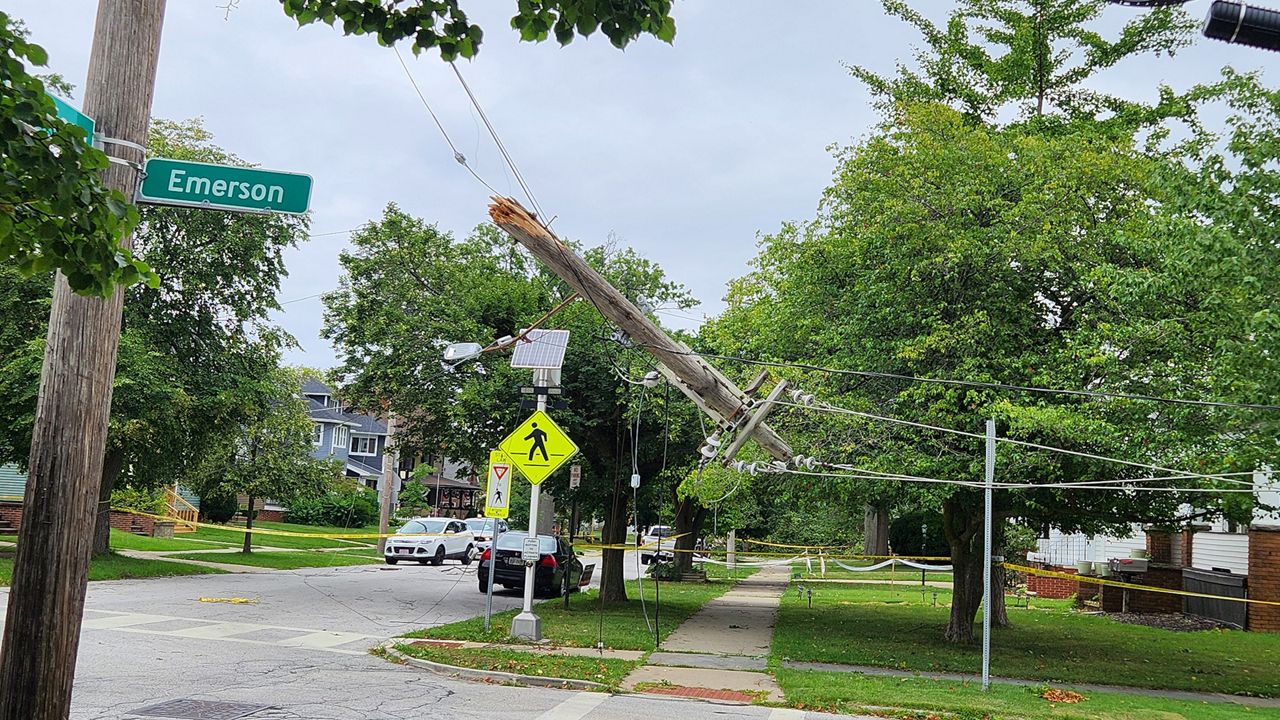 A power pole is tangled in wires.