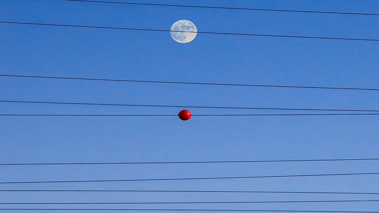 The meaning behind those colorful balls on power lines