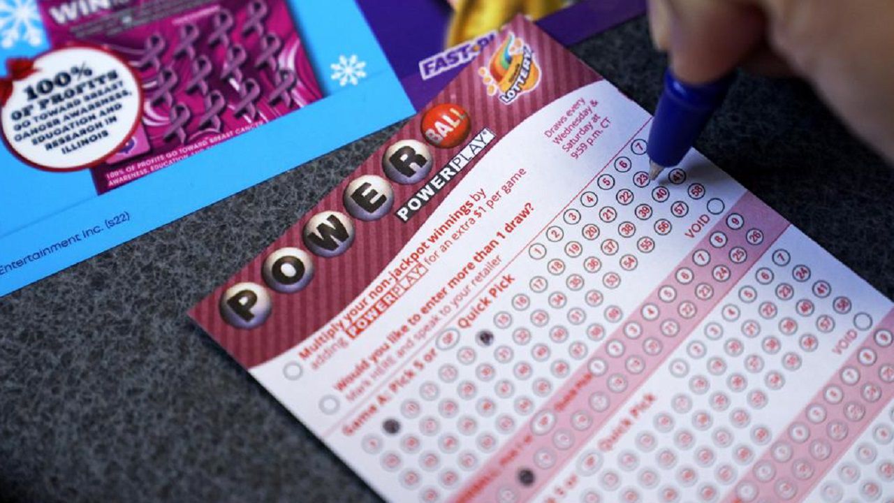 FILE - A customer fills out a Powerball lottery ticket Tuesday. No one won an estimated $700 million Powerball jackpot Wednesday night, meaning the big prize will grow to an estimated $800 million for the next drawing. (AP Photo/Nam Y. Huh, File)