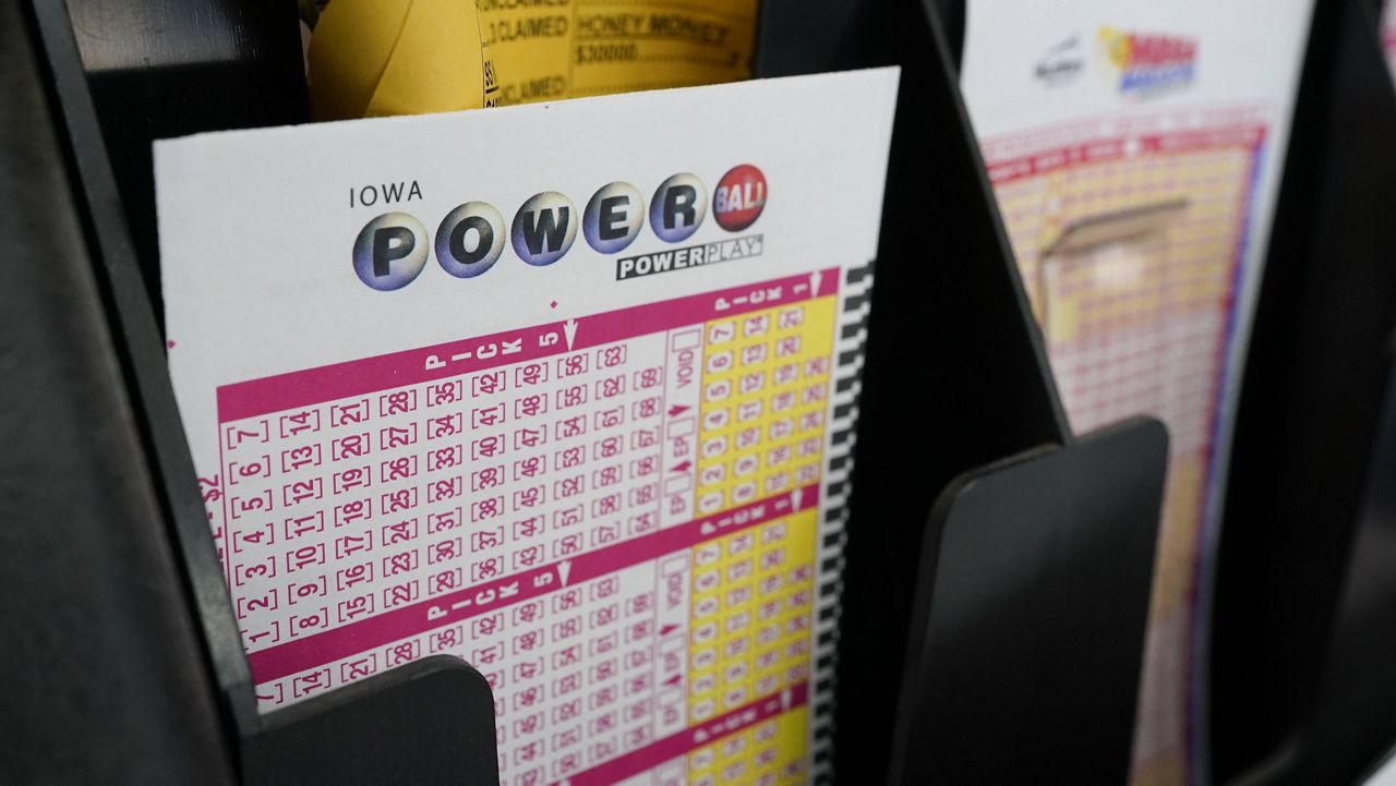 Blank forms for the Powerball lottery sit in a bin at a local grocery store in Des Moines, Iowa. (AP Photo/Charlie Neibergall, File)