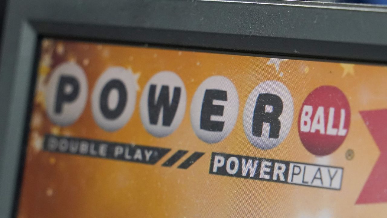 A display panel advertises tickets for a Powerball drawing at a convenience store, Nov. 7, 2022, in Renfrew, Pa. There is an $865 million Powerball jackpot up for grabs Wednesday night, March 27, 2024. (AP Photo/Keith Srakocic, File)