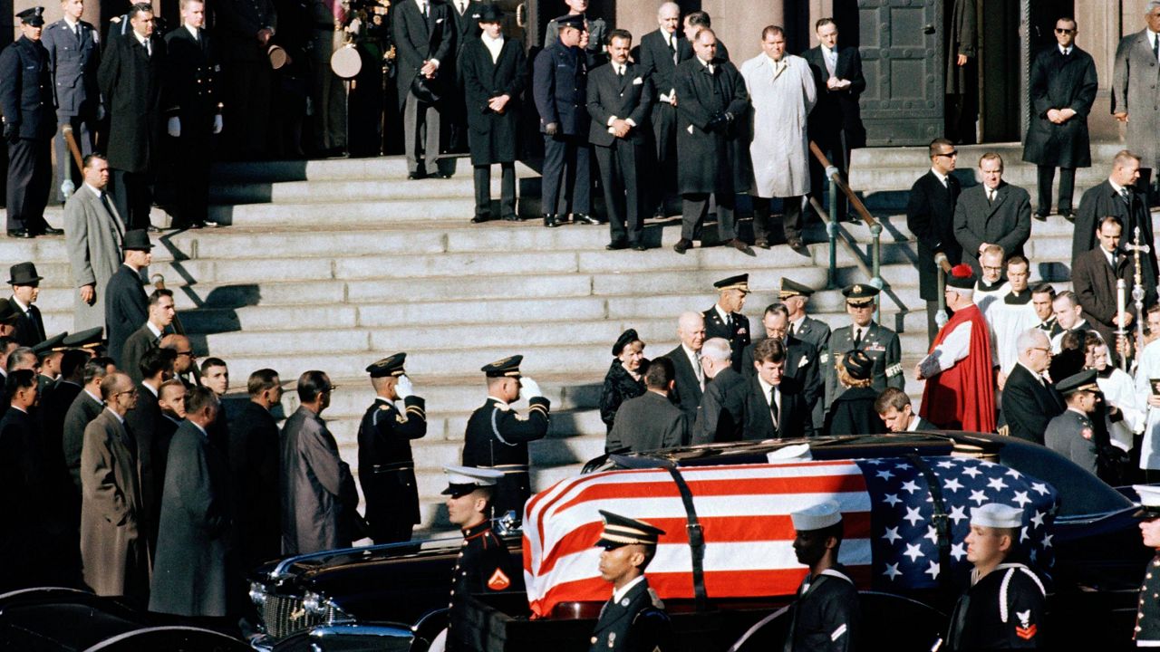 A general view outside St. Matthew's Cathedral in Washington, D.C., during President John F. Kennedy's funeral, with flag-draped coffin in the foreground, Nov. 25, 1963. (AP Photo, File)