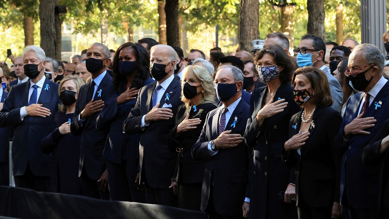 Former President Bill Clinton, former First Lady Hillary Clinton, former President Barack Obama, former First Lady Michelle Obama, President Joe Bien, First Lady Jill Biden, former New York City Mayor Michael Bloomberg, Bloomberg's partner Diana Taylor, Speaker of the House Nancy Pelosi (D-CA) and Senate Minority Leader Charles Schumer (D-NY) stand for the national anthem during the annual 9/11 Commemoration Ceremony at the National 9/11 Memorial and Museum on Saturday, Sept. 11, 2021 in New York. (Chip Somodevilla/Pool Photo via AP)