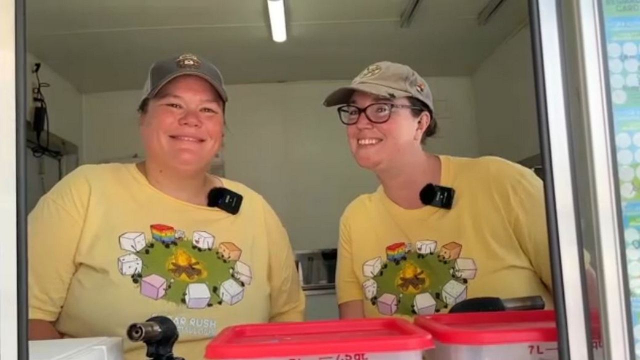 Wife and wife team Julie (left) and Jean Summers run the Sugar Rush Marshmallows food truck and say they love to work together, optimistically. (Spectrum News/Chris Krul)