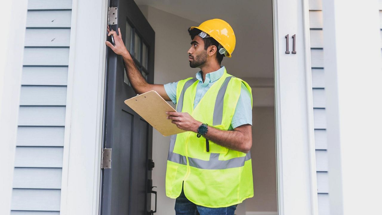 a guy assessing a property
