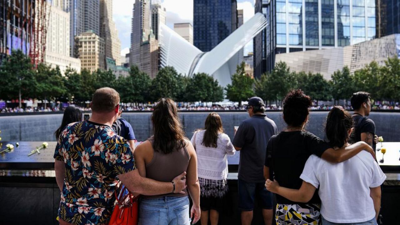  Members of the public arrive at the south pool after the conclusion of ceremonies to commemorate the 20th anniversary of the Sept. 11 terrorist attacks, Sept. 11, 2021, at the National September 11 Memorial & Museum, in New York. On Sunday, Sept. 11, 2022, Vice President Kamala Harris and her husband are due at the ground zero observance, but by tradition, no political figures speak there. Instead, victims' relatives take turns in an hours-long reading of the names of the dead. (AP Photo/Matt Rourke, File)