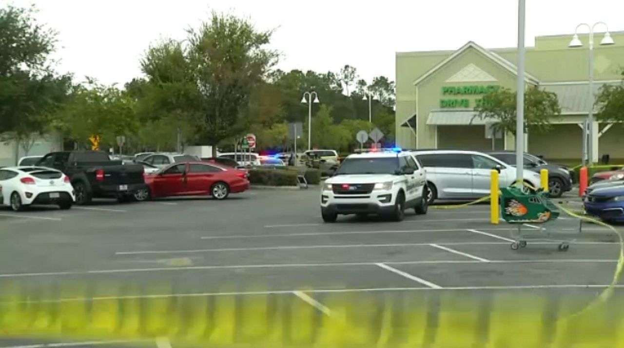 An Osceola County Sheriff's Office vehicle sits in the parking lot of a Celebration Public following a shooting that left a 17-year-old injured. (Spectrum News/Greg Angel)