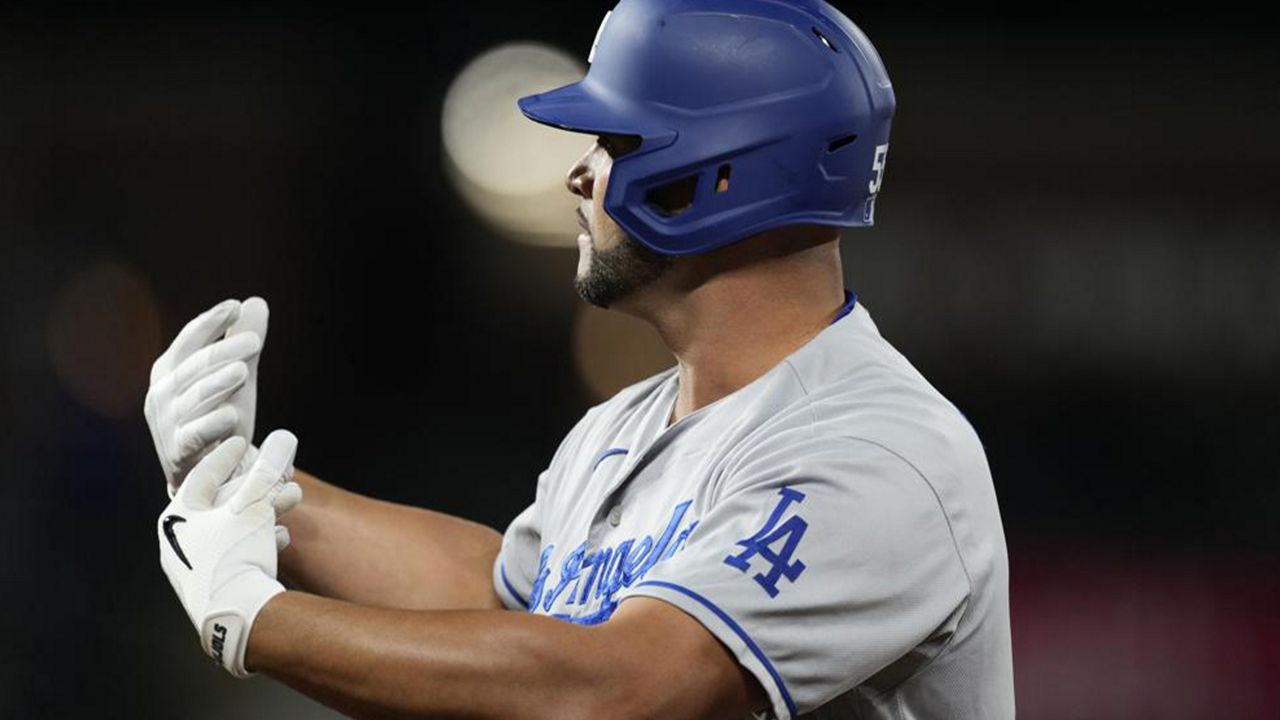 Pujols hit in 10th, Dodgers beat Rox, stay close in NL West