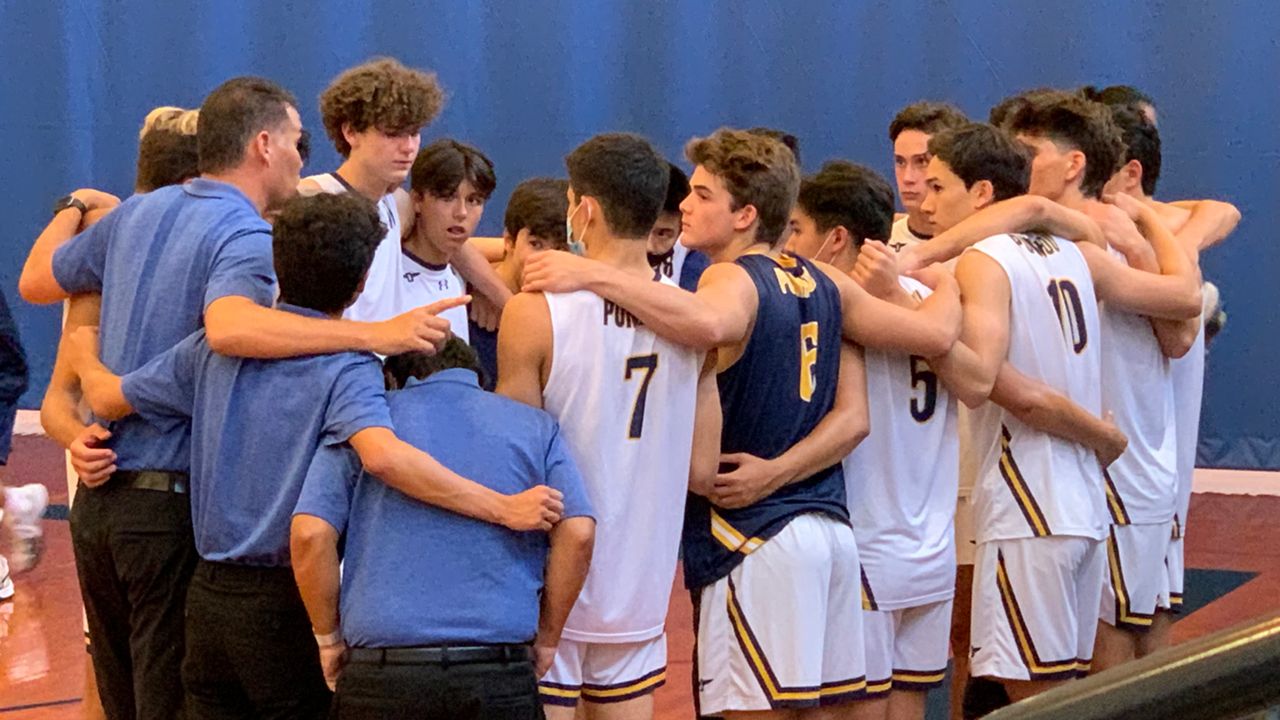 The Punahou boys volleyball team spoke in a huddle before facing Kamehameha at Hemmeter Fieldhouse on Wednesday. 